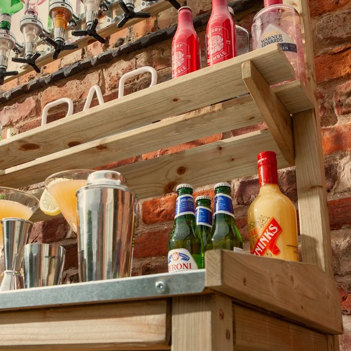 This mini garden bar is a perfect way to keep your guests supplied with cocktails, wines, beers etc in the comfort of your own garden space. This compact bar unit is perfect to situate in most garden areas.